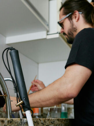 man washing dishes in a sink man washing dishes in a sink