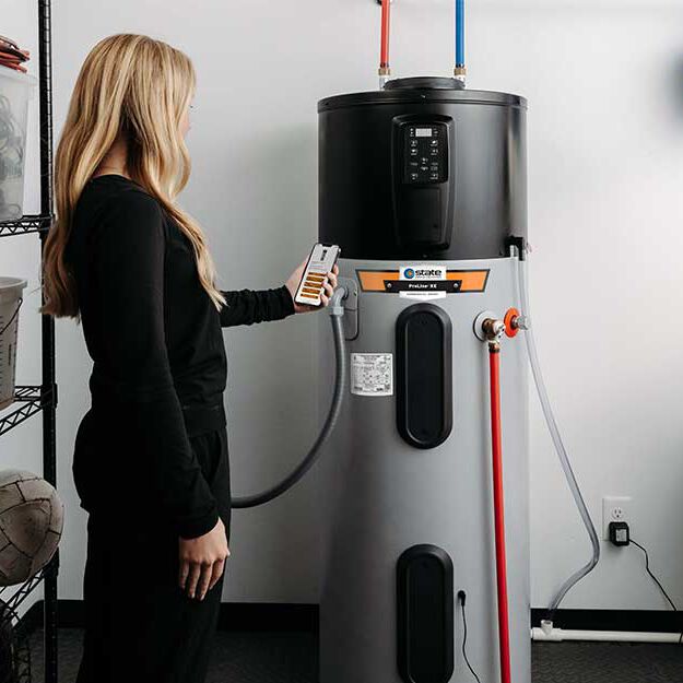 person scanning a qr code on a water heater person scanning a qr code on a water heater