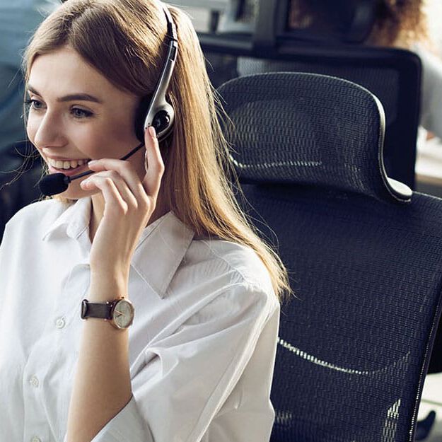 Agent on call while looking at computer Agent on call while looking at computer