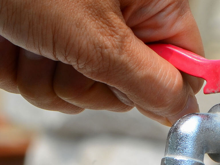 person turning valve person turning valve