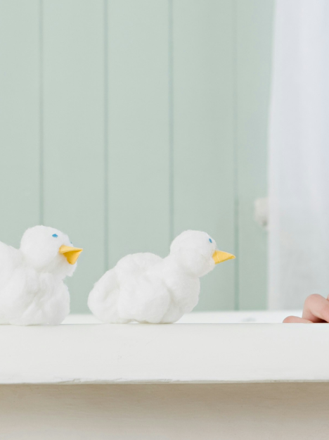 woman in a bathtub with rubber ducks woman in a bathtub with rubber ducks