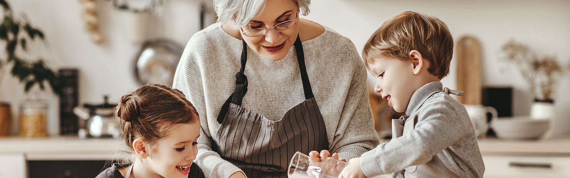 family smiling at sink