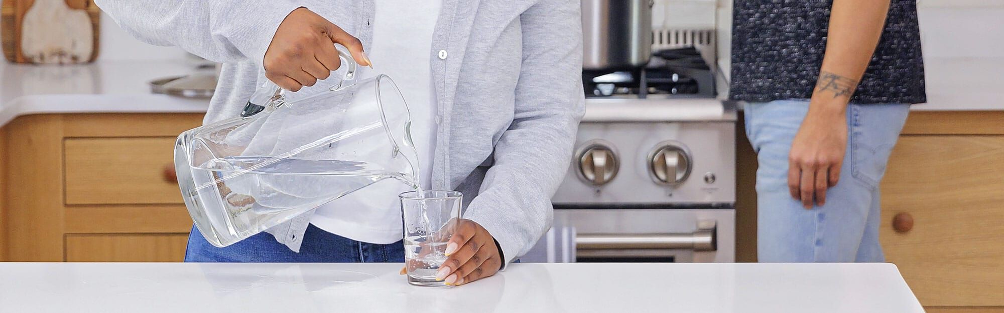 family smiling at sink