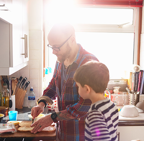 Father and son making sandwiches.