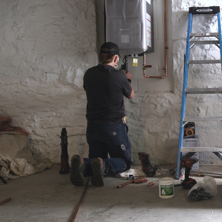 Plumber installing Adapt plus